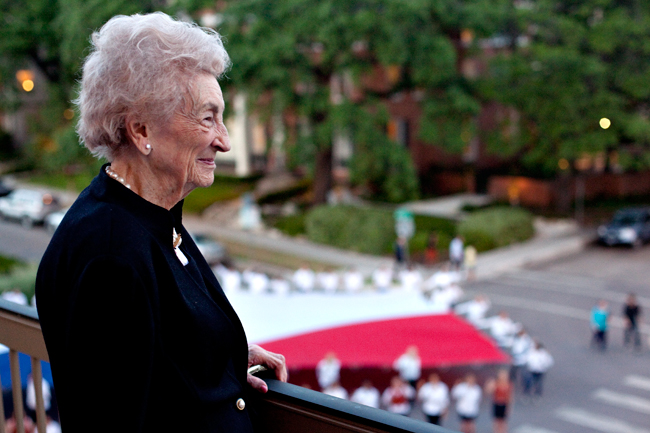 <p>Margaret C. Berry smiles after being surprised by Alpha Phi Omega with a giant Texas flag at the AT&T Conference Center Friday night. Berry was honored earlier that day as the namesake of the ground floor atrium of the Student Activity Center.</p>
