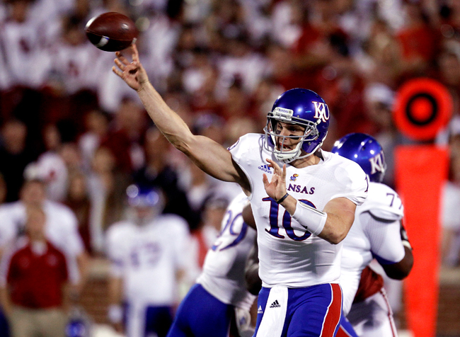 Kansas quarterback Dayne Crist throws against Oklahoma in the second quarter of a game in Norman, Okla., Saturday, Oct. 20. Crist has been largely ineffective this season and now redshirt freshman Michael Cummings has assumed the starting role.