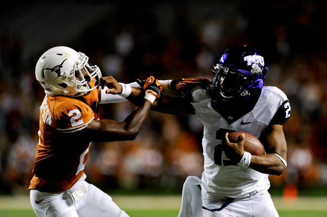 <p>Safety Mykkele Thompson is unable to bring down TCU quarterback Trevone Boykin in the Longhorns' loss to the Horned Frogs last Thanksgiving. Texas face Iowa State this Thursday, marking its first weekday game not played on Thanksgiving Day since a win over Houston in 1993. Iowa State has won 10 of its last 12 Thursday contests. </p>

