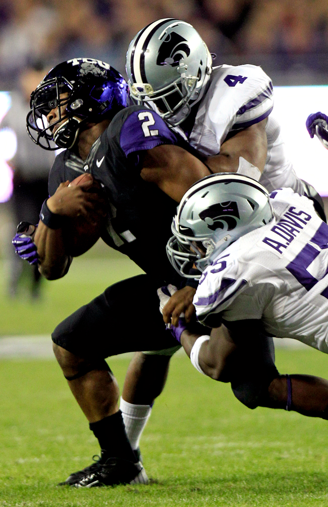 Quarterback Trevone Boykin #2 of the TCU Horned Frogs looks for an open  receiver against the Oklahoma Soon…