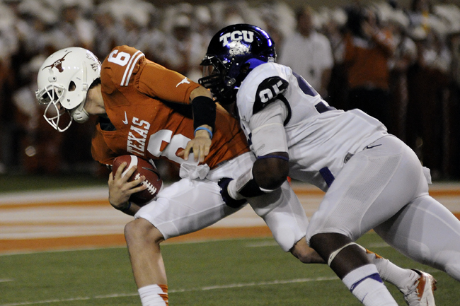 <p>Case McCoy is brought down by TCU’s Devonte Fields during Texas’ 23-10 loss last Thursday. The Longhorns fell to 8-3 on the year. </p>
