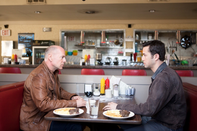 <p>Bruce Willis and Joseph Gordon-Levitt play two versions of the same character in Rian Johnson's mind-bending "Looper" (Photo courtesy of Sony Pictures).</p>
