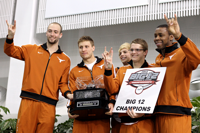 <p>Several members of the Texas men’s swimming and diving team celebrate winning the Big 12 title Saturday, the program’s 34th straight conference championship. The Longhorns women’s swimming and diving squad also won a conference title, its 11th since joning the Big 12.</p>
