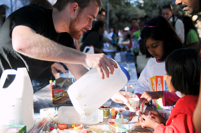 <p>Nick Mitchell from the College of Natural Sciences explains an experiment to visitors at Explore UT on Saturday. The biggest college open house in Texas, Explore UT provided an opportunity for visitors to delve into programs on the UT campus.</p>
