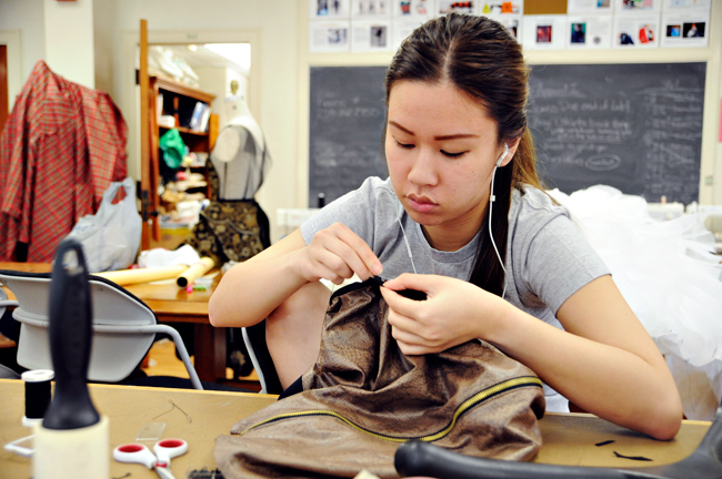 <p>Design senior Cecillia Vu adds finishing touches to her garment Wednesday afternoon as final preparation for the 14th annual University of Texas Fashion Show. The event is free for the public and will take place at the Frank Erwin Center on Thursday evening.</p>
