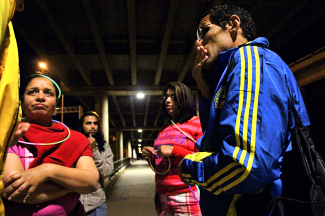 <p>Runners Amardeep Kahlon and Ron Mora converse in a group on the trail at Lady Bird Lake on Thursday evening, where a vigil run was organized in support of the victims of the Boston Marathon bombings.</p>
