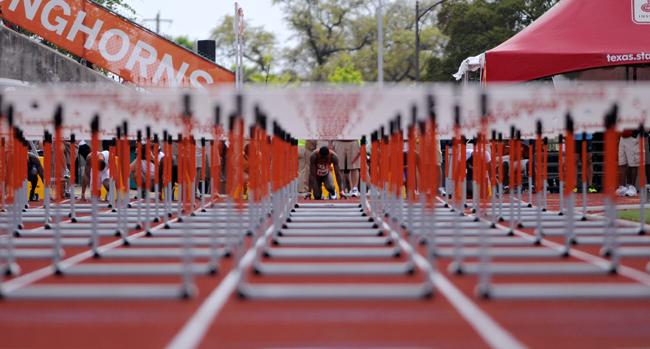 <p>Athletes prepare to run the 110-meter hurdles in last year's Texas Relays. The 2014 event will daw 652 high schools, 232 colleges and competitors from nine countries.</p>

