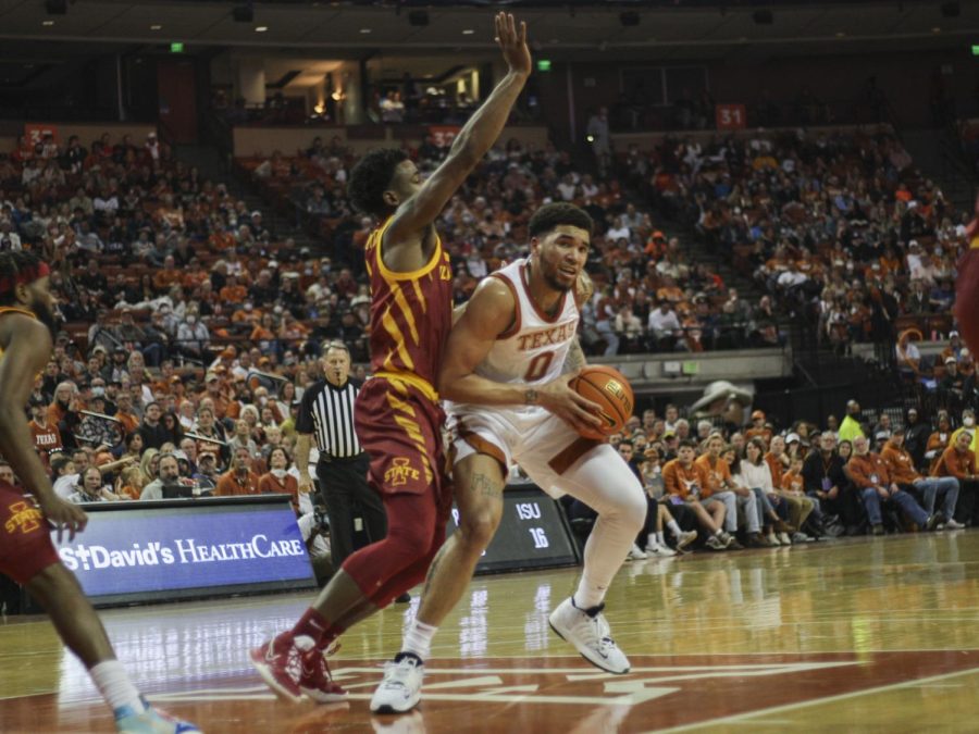 Timmy Allen stops to pass the ball during a game against Iowa State. Texas won 63-41 on February 5, 2022.
