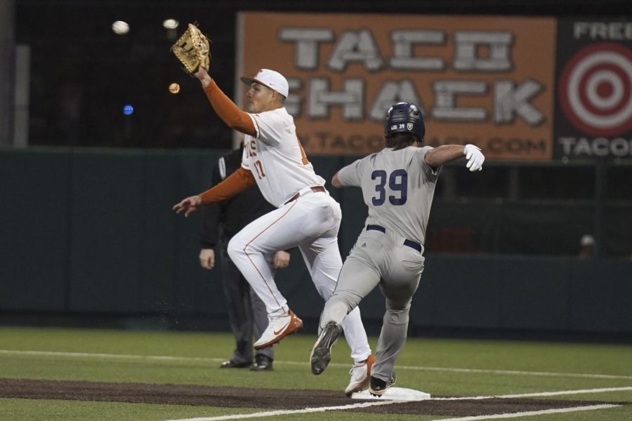 Texas+baseball+first+basemen+Ivan+Melendez+uses+his+glove+to+help+secure+the+out+at+first+base.+Texas+played+Rice+at+UFCU+Disch-Falk+Field+on+Feb+18%2C+2022.