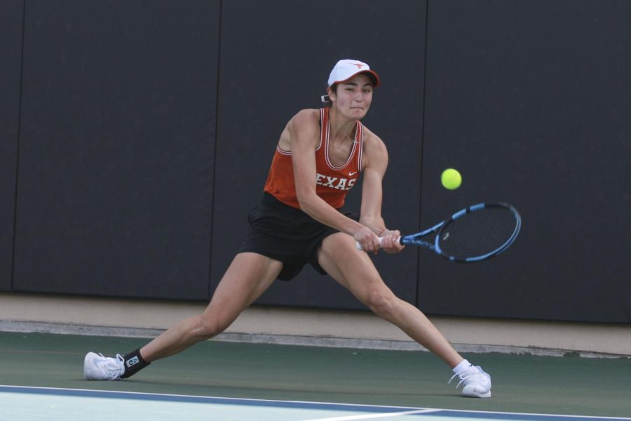 Maneuvering+around+the+court%2C+freshman+Sabina+Zeynalova+faces+off+against+NC+State%E2%80%99s+senior+Nell+Miller.+Zeynalova+won+her+singles+match+in+two+sets+with+scores+of+6-0+and+6-1.