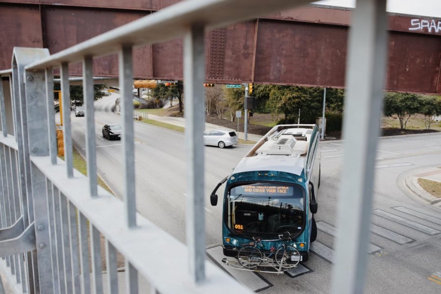 An Austin Metrobus makes a turn at Lamar Blvd. and W Cesar Chavez St., as seen from the Pfluger Pedestrian Bridge on February 8, 2021.