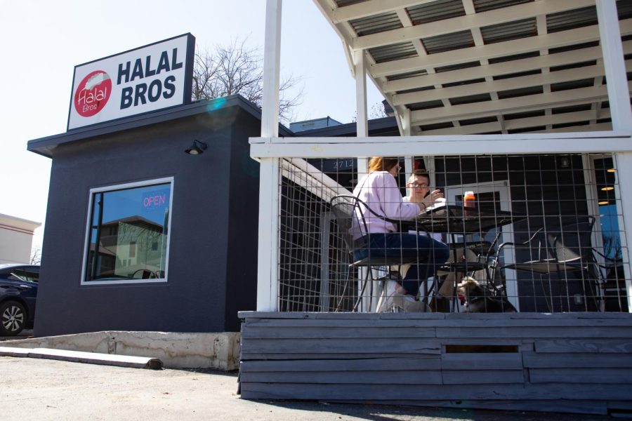 Customers eating on the outdoor patio at Halal Bros on Feb. 27, 2022.  Halal Bros recently reopened after a fire destroyed the building last April.