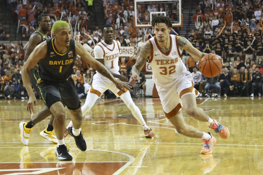Forward Christian Bishop dribbles toward the basket on February 28, 2022 at the Frank Erwin Center.