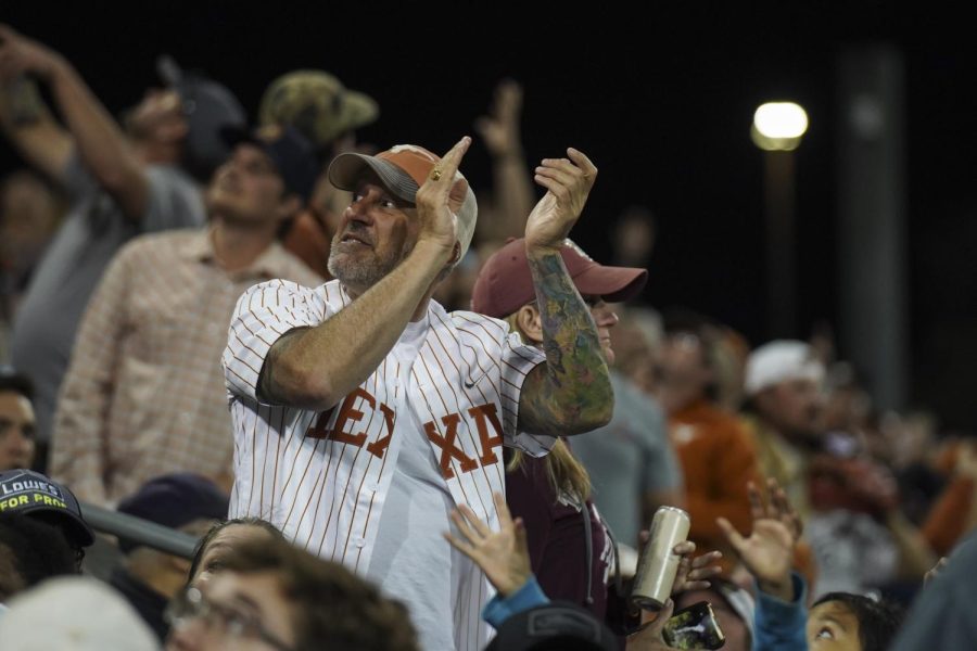 A Texas Baseball fan cheers after a crucial home run against the rival Aggies. The Longhorns ultimately fell to Texas A&M 12-9 on March 29th, 2022.