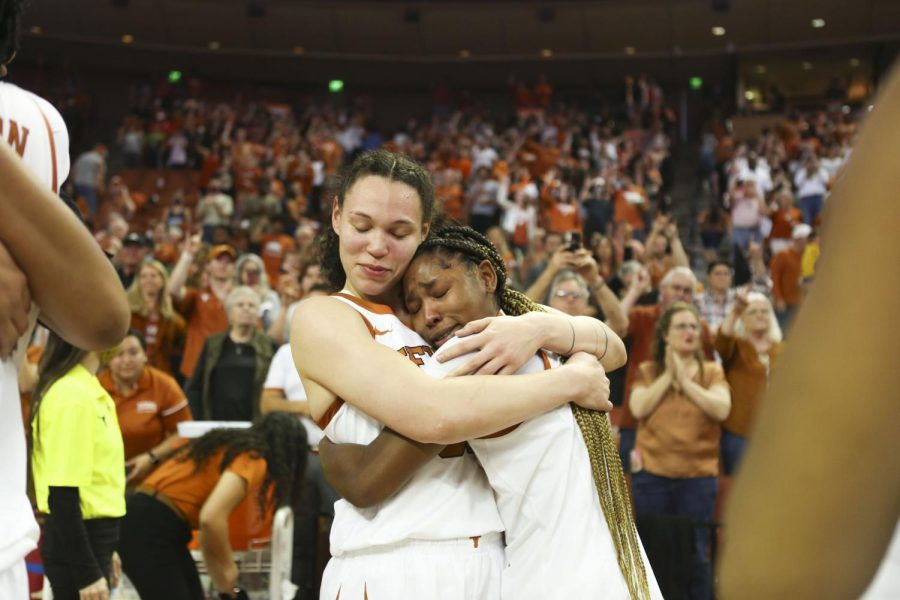 Audrey Warren and Aliyah Matharu hug after beating OSU 50-65 at the Frank Erwin Center. Texas Womens Basketball played their last ever game on Saturday, March 5, 2022. 