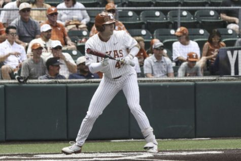Senior Outfielder goes in for a bunt on April 23, 2022, at the UFCU Disch-Falk Field. 