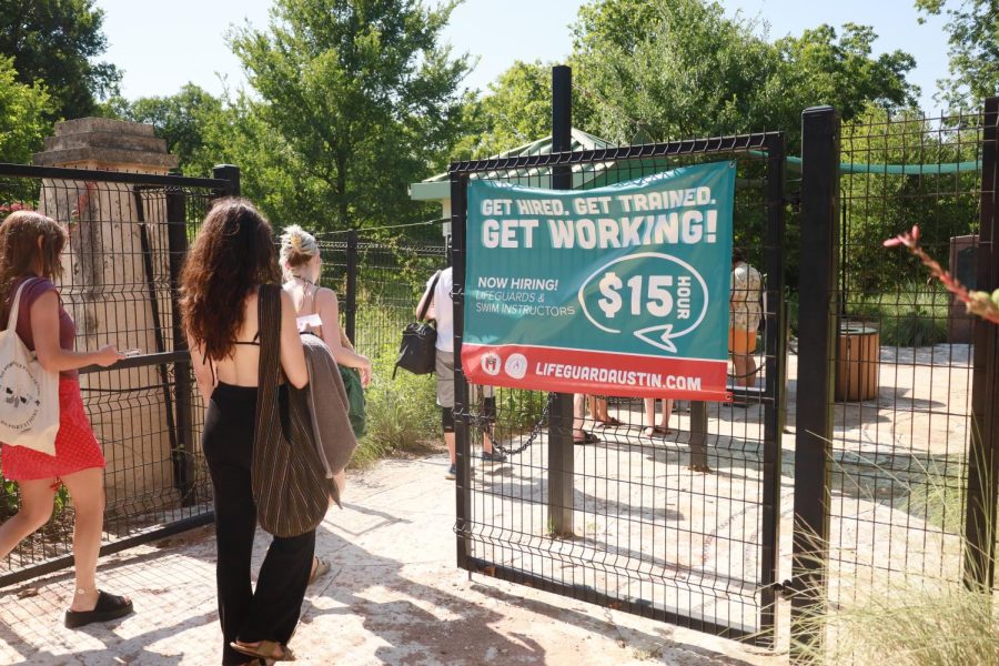 Patrons walk through the gates at the Barton Springs Pool at Zilker Park on June 5, 2022. Austin Public pools have been closed  or operating with limited hours due to a lifeguard labor shortage.