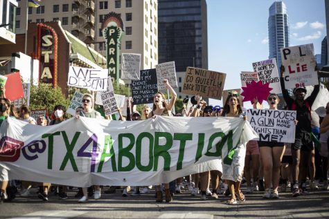Protesters march down Congress Avenue on Saturday, June 25. A crowd of several hundred attendees gathered to protest the Supreme Court’s ruling to overturn Roe v Wade.