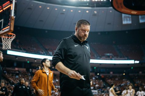 Texas head basketball coach Chris Beard leaves the court for halftime during a game against UTRGV on Dec. 3, 2021. 