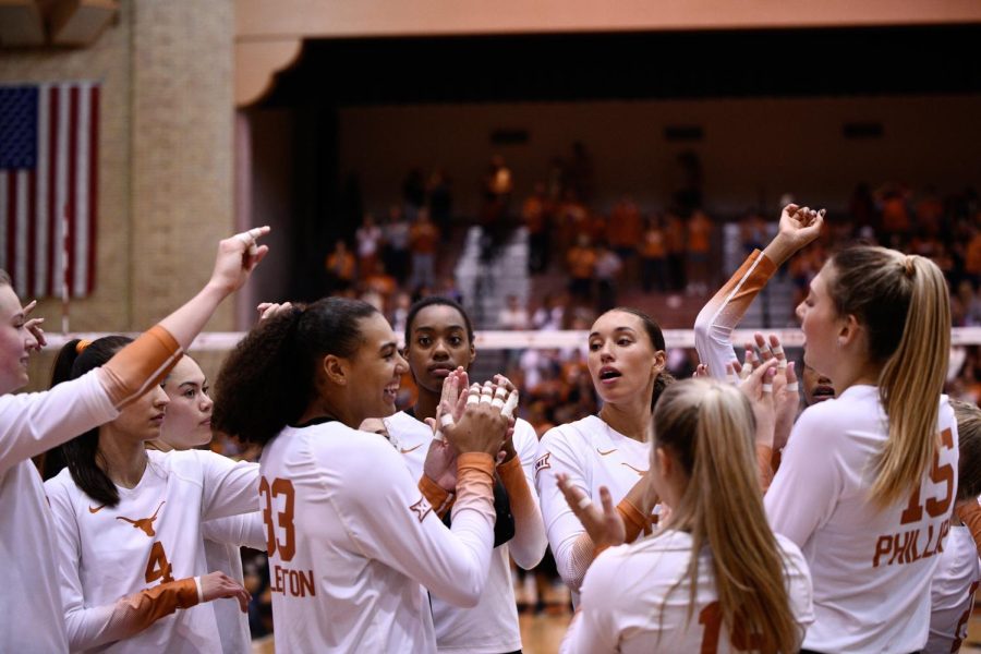 The Texas Volleyball Team in a celebratory huddle at last years game in Gregory Gym.
