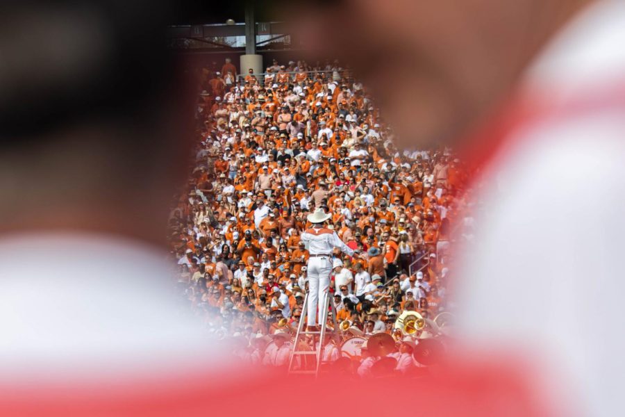 The Texas drum major leads the Longhorn band during halftime at the UT vs. OU football game on Oct. 8, 2022. The rivalry game was held at the Cotton Bowl Stadium in Dallas, Texas.  