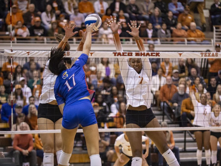 Senior Asjia ONeal jumps to hit the ball during a game against Kansas on Nov. 16, 2022. Texas won 3-0.