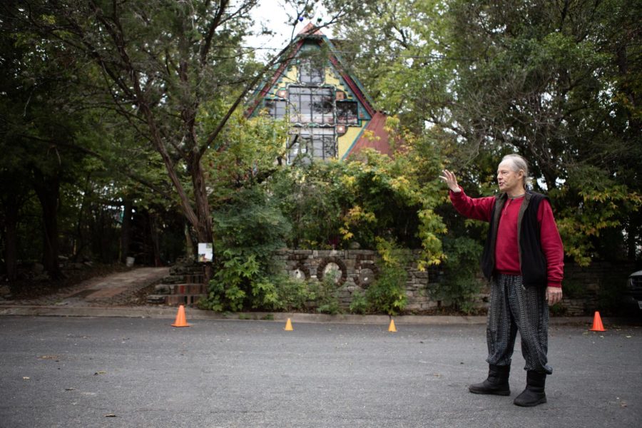 James Talbot stands outside his house on Milton Street, two blocks from South Congress Ave. Talbot offers tours of the house, which has become a standing art piece located in rapidly gentrifying Austin.