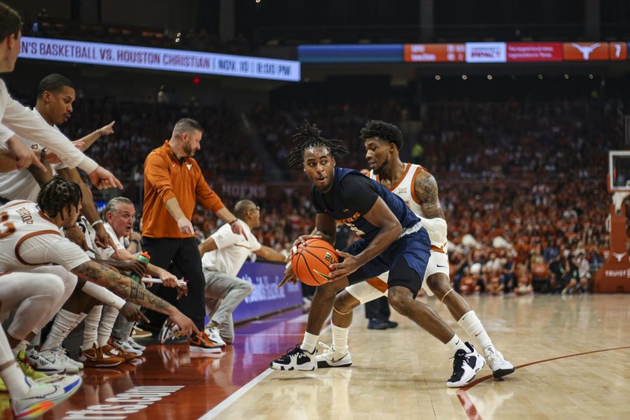 Texas players point as UTEP Senior Guard Shamar Givance lands a foot out of bounds during a game on Nov. 7. The Longhorns won 72-57.