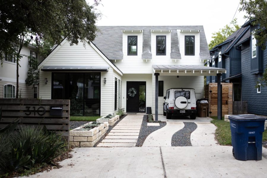 A recently renovated home stands directly across the street from Casa Neverlandia. New construction and development has changed the landscape of many historic Austin neighborhoods in recent years.