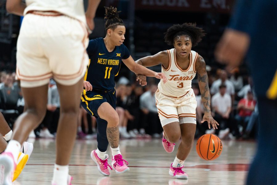 Texas bounces back from road loss, beating West Virginia 74–48