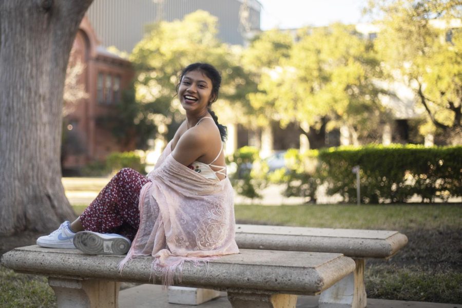 Philosophy senior Emma Guerrero sits outside of the Littlefield House on Feb. 27, 2023. Guerrero was recently cast as the lead for the UT play Cult Classic Vacation.