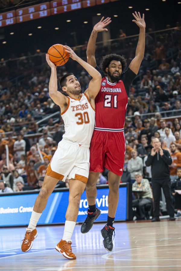 Graduate student Brock Cunningham makes a layup during a game against Louisiana on Dec. 21, 2022. The Longhorns won 100 to 72.