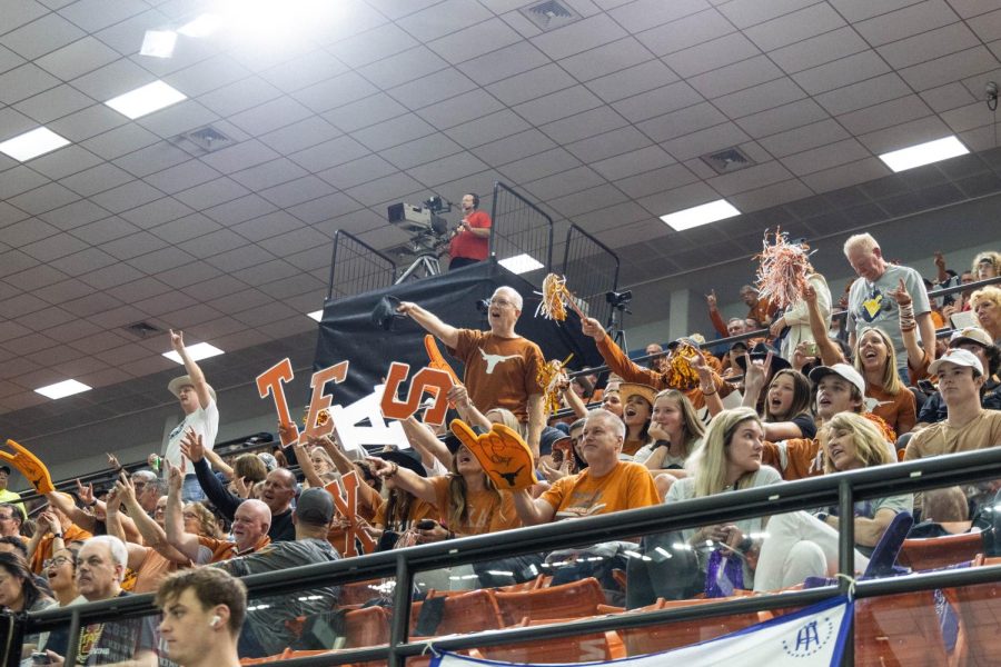 Texas fans cheer as team competes in the Big 12 Swimming and Diving Championship at the Lee and Joe Jamail Texas Swimming Center on Feb. 25, 2022. The University of Texas was named Big 12 Champions for mens and womens events. 