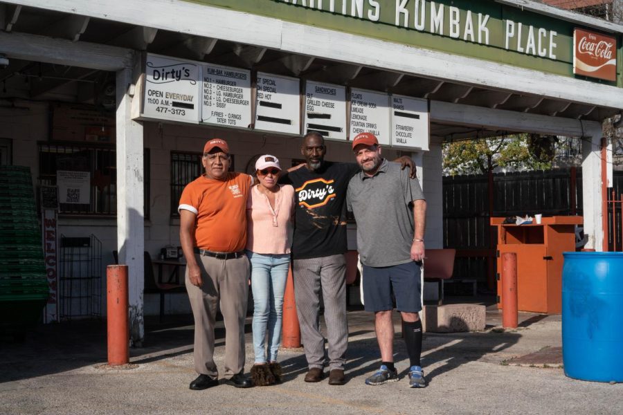 In order from left to right, Valentin, Betsy Berry, Robert Hughes and Daniel Young stand in front of Dirty Martin’s, an Austin burger restaurant located on Guadalupe Street. Young is the general manager of Dirty Martin’s, and has continued to fight to keep the burger joint open.  