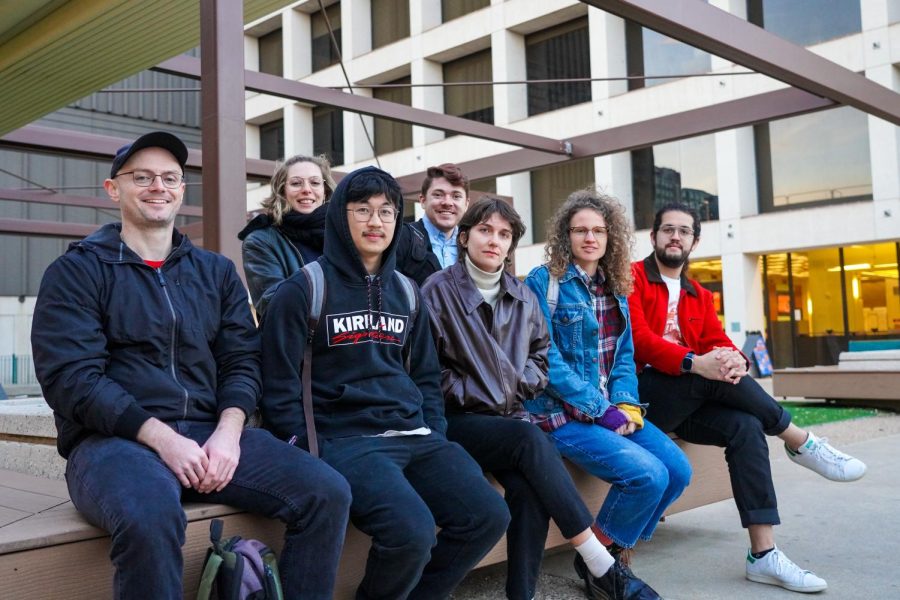 Members of Underpaid@UT sit together in the CMA patio on Feb. 17, 2023. The organization wants to raise awareness of the difficulties graduate students experience and advocate for a pay increase.