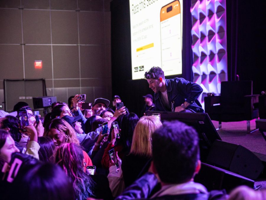Fans crowd around to take photos as Nick Jonas exits the stage at the Austin Convention Center on March 13, 2023. Jonas spoke about diabetes and resource access for patients.
