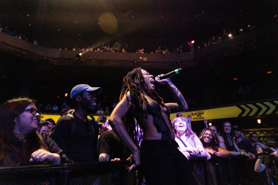 Fans gather and cheer as Brittney Parks, known as stage name Sudan Archives, leans into the crowd during a perfomance at the ACL Live Moody Theater on March 16, 2023.
