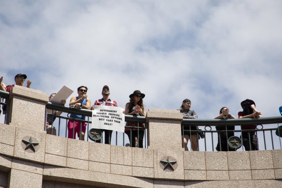 Protestors stand atop the open-air rotunda at the Texas state capitol on March 27, 2023. The rally was held in protest of two bills that, if passed, would prohibit gender transitioning in youth.