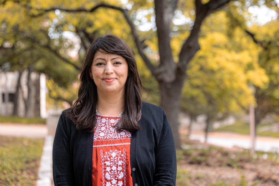 On March 28, UT-Austin associate professor Monica Muñoz Martinez poses outside of a history building on campus. Recently, Martinez was named USA Today Woman of the Year.