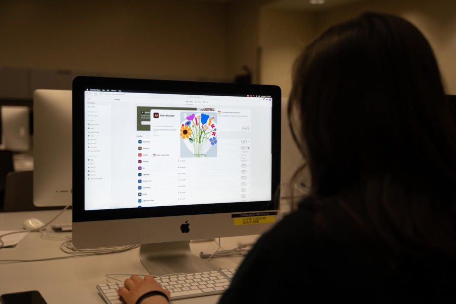  A student at the University of Texas at Austin launches Adobe Illustrator inside the G. B. Dealey Center for New Media on March 6, 2023.