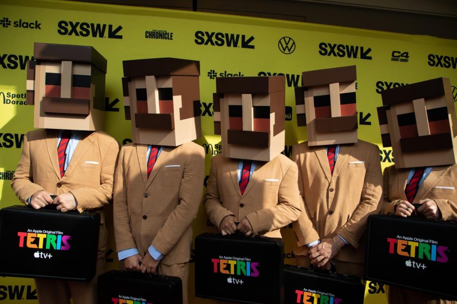 People dressed as Tetris characters appear on the red carpet on March 15, 2023. 