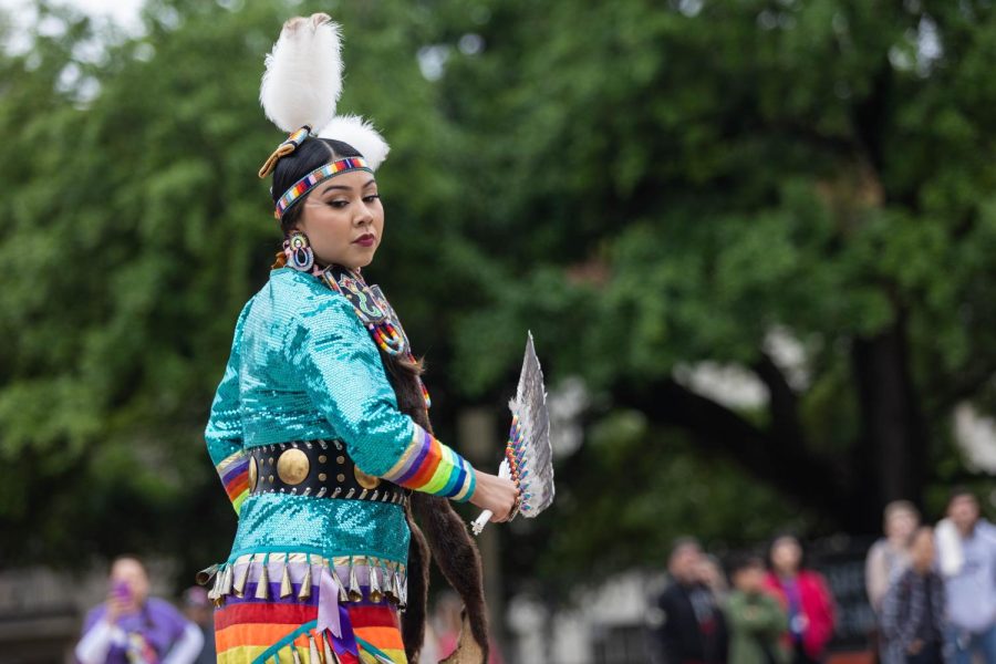 Head Lady Naakaii Tsosie dances at the UT Austin Powwow on April 8, 2023. 