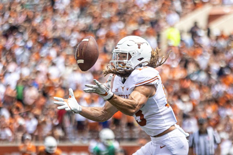 The Texas Longhorns compete with their teammates in the annual Orange v. White game on April 15, 2023. 