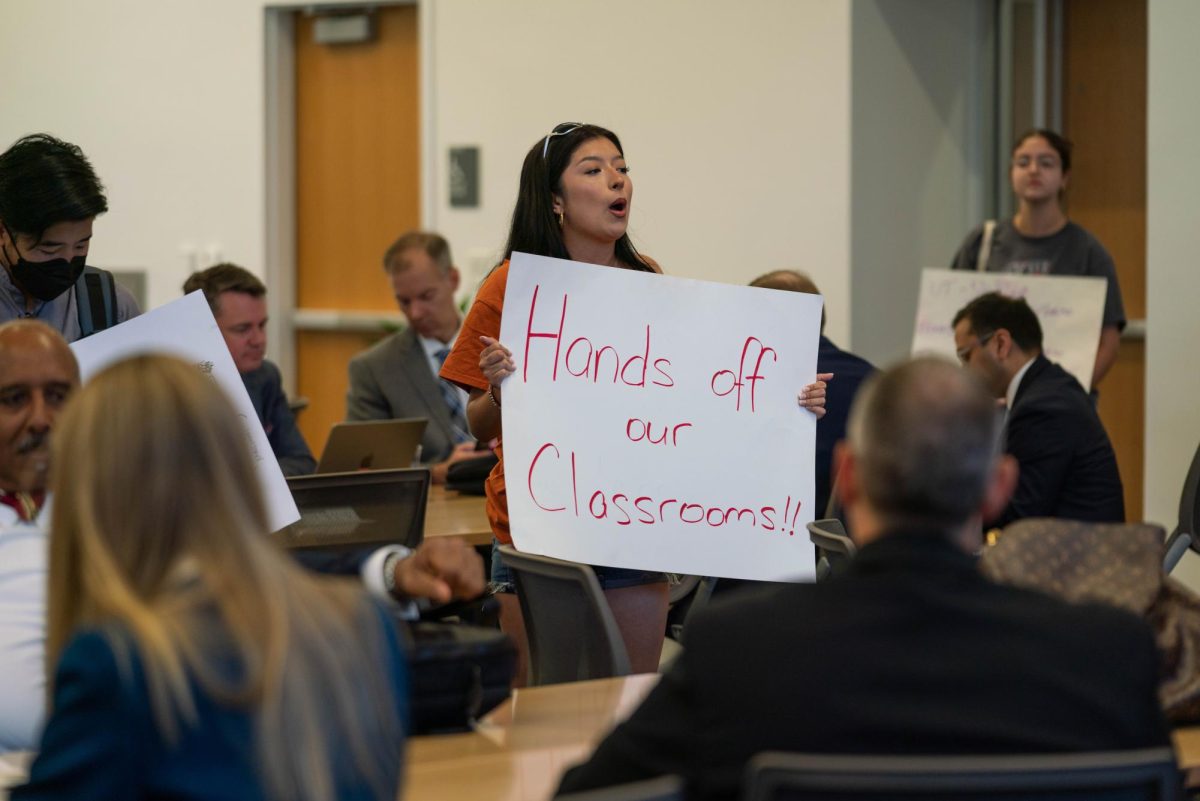 UT freshman government student Genesis Britz advocates for University DEI during the recess of a UT Board of Regents meeting on Aug. 24, 2023. 