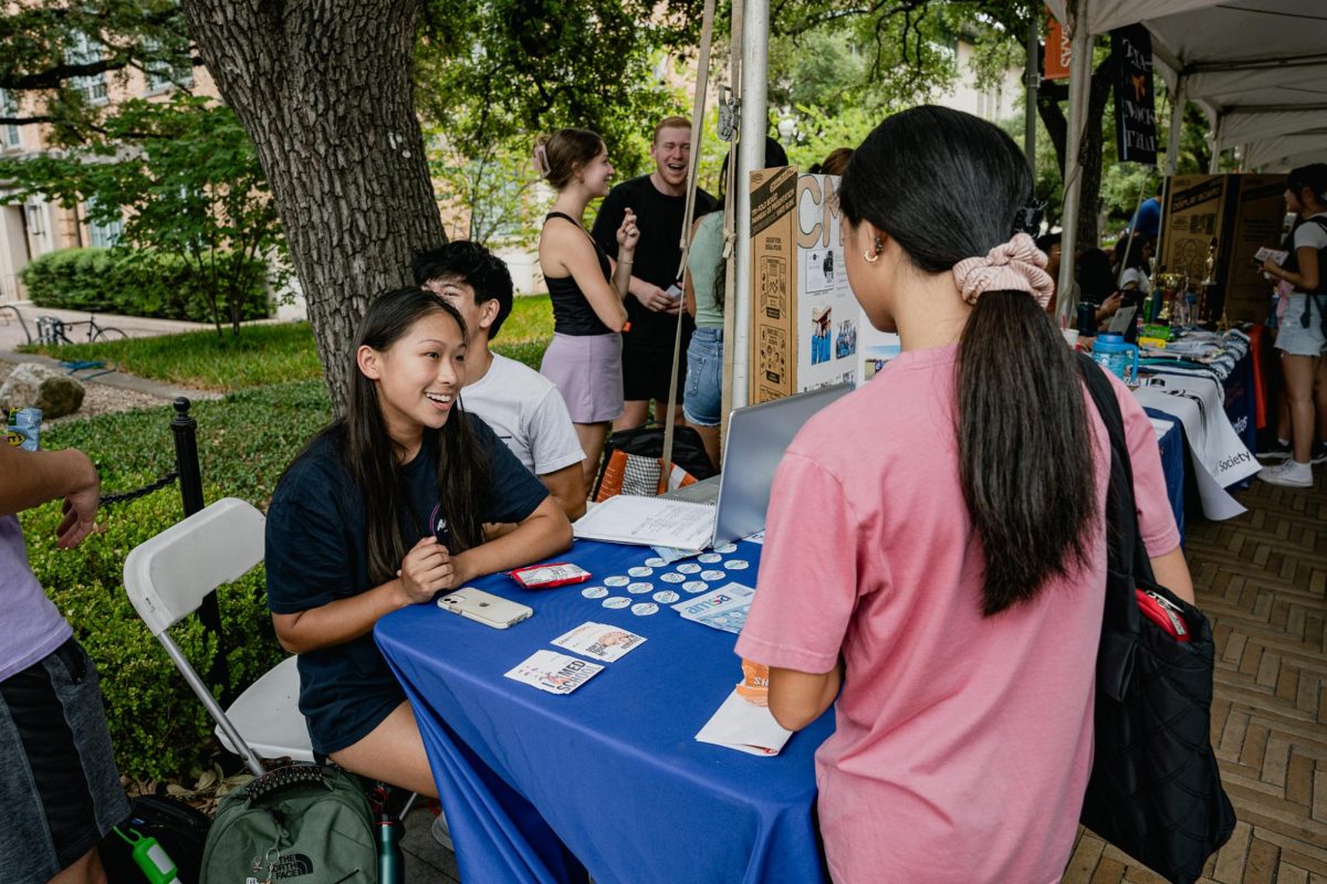 Sally Lin, representing American Medical Students Association, speaks to prospective members at a booth on Speedway as a part of the University of Texas at Austins Party on the Plaza event on August 30, 2023.