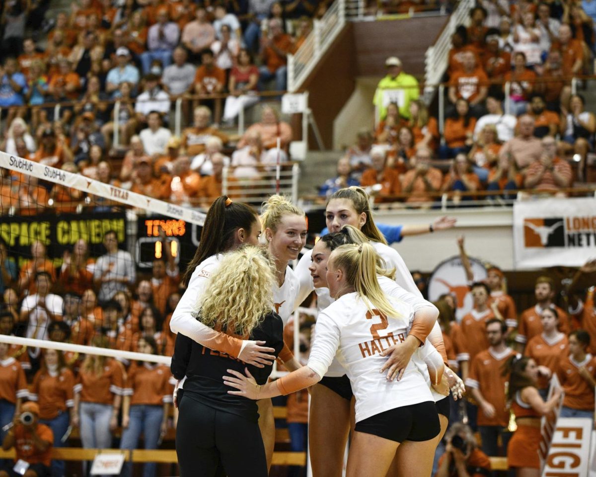 Texas Volleyball players huddle up during game against Minnesota on Aug. 29, 2023.