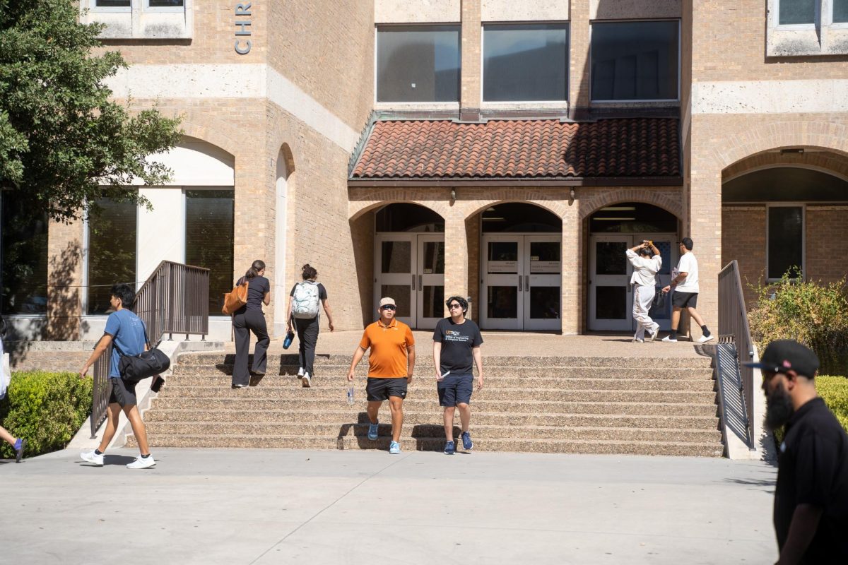 Students and parents walk outside Jester during move in week on August 18, 2023.