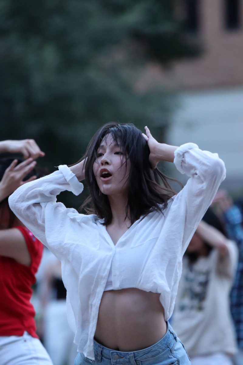A student sings and dances along to Korean pop music on Sept. 1, 2023. Many students come out to support the Korean Dance Crew club on that Friday night.
