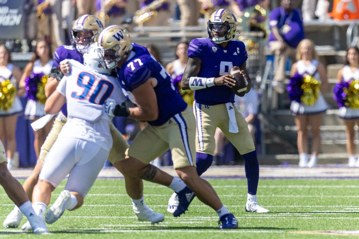 Washington quarterback Michael Penix Jr looks to pass the ball during Washington's football game against Boise State on September 2, 2023 at Husky Stadium.