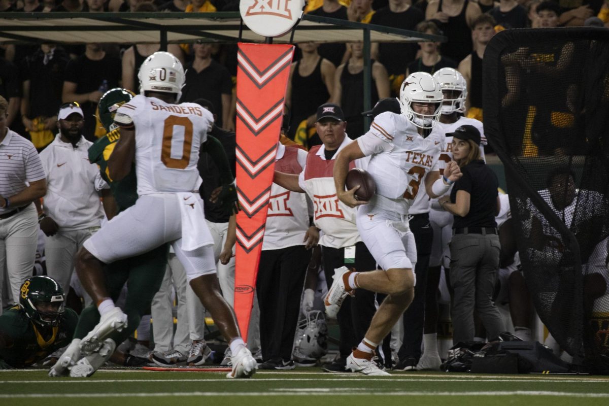 Tight+end+JaTavion+Sanders+blocks+a+tackle+and+makes+room+for+quarterback+Quinn+Ewers+to+score+a+touchdown+during+Texas+game+against+Baylor+on+September+23%2C+2023.+The+Longhorns+defeated+the+Bears+38-6+in+their+first+Big+12+conference+game+of+the+season.